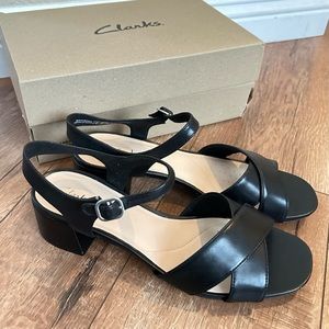 Clark’s Women’s black strap leather sandals. Size 9. New, never worn.